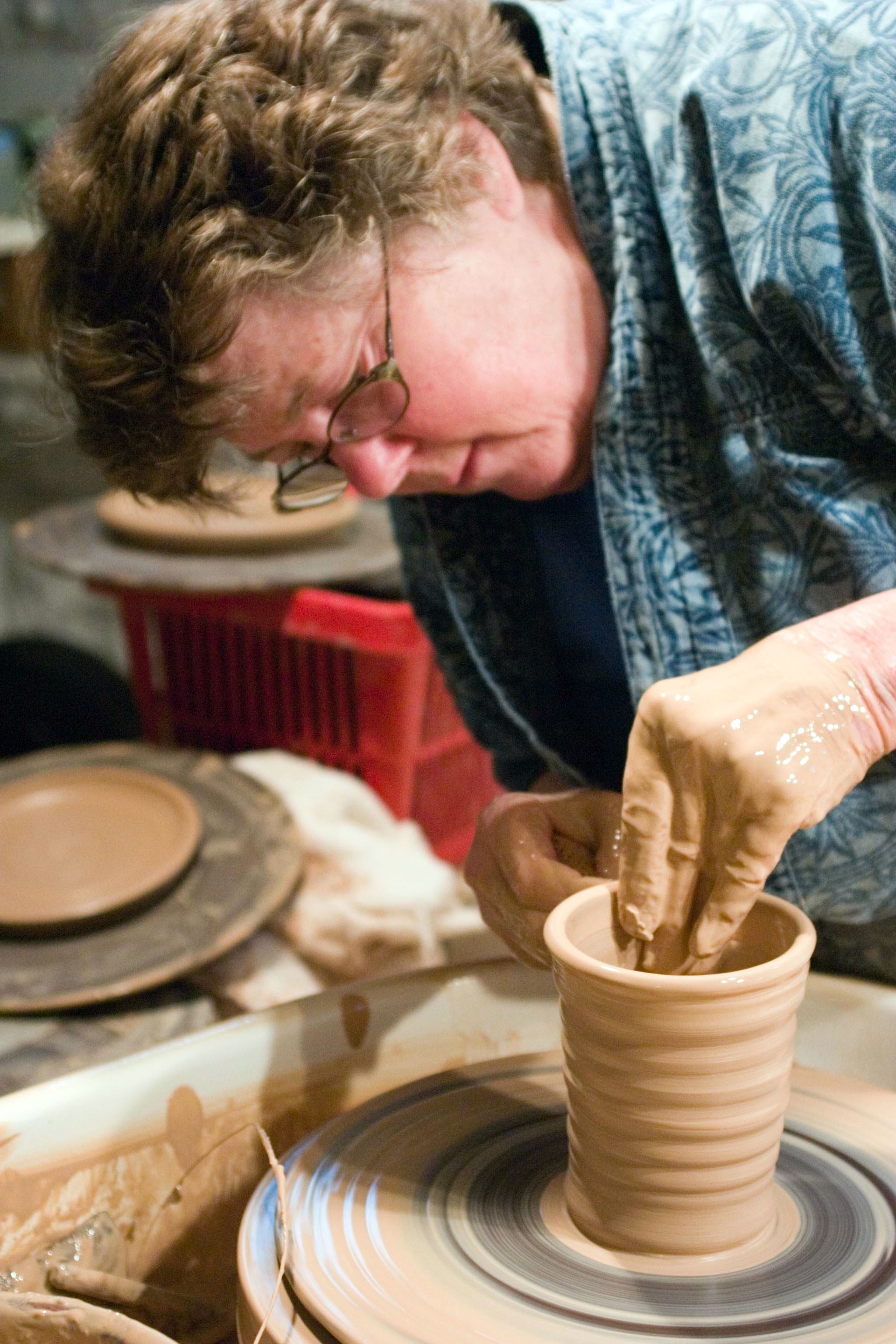 Kit at her wheel in her studio, 2005.