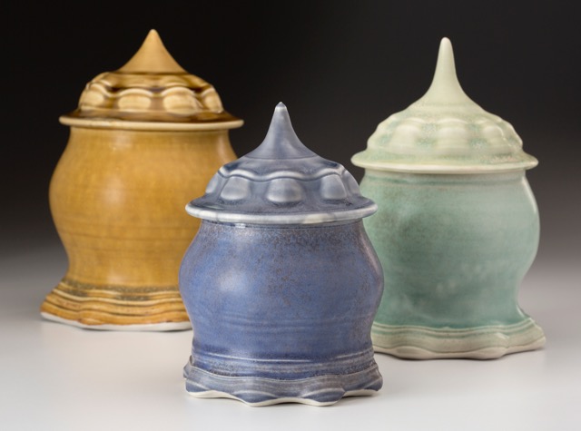 Aysha Peltz, Three Lidded Jars, 2016. Blue 6 x 4 in., Amber 8 x 5 in., Green 7 x 4 in., Wheel-thrown and altered. Cone 10 oxidation.
