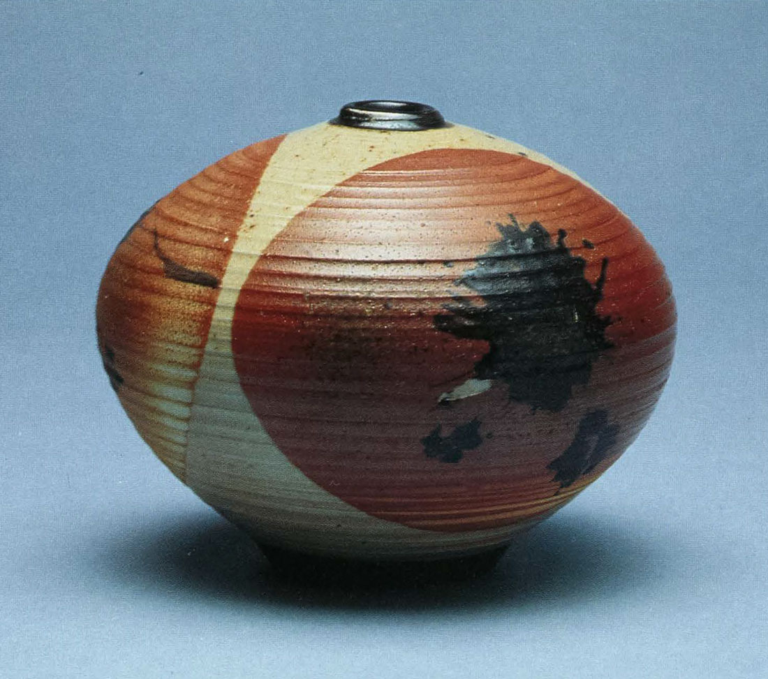 Woodfired Bottle. Porcelain, Double Dipped in Avery Clay With Black Slip Splash. 6 in. x 7 in. 1993.