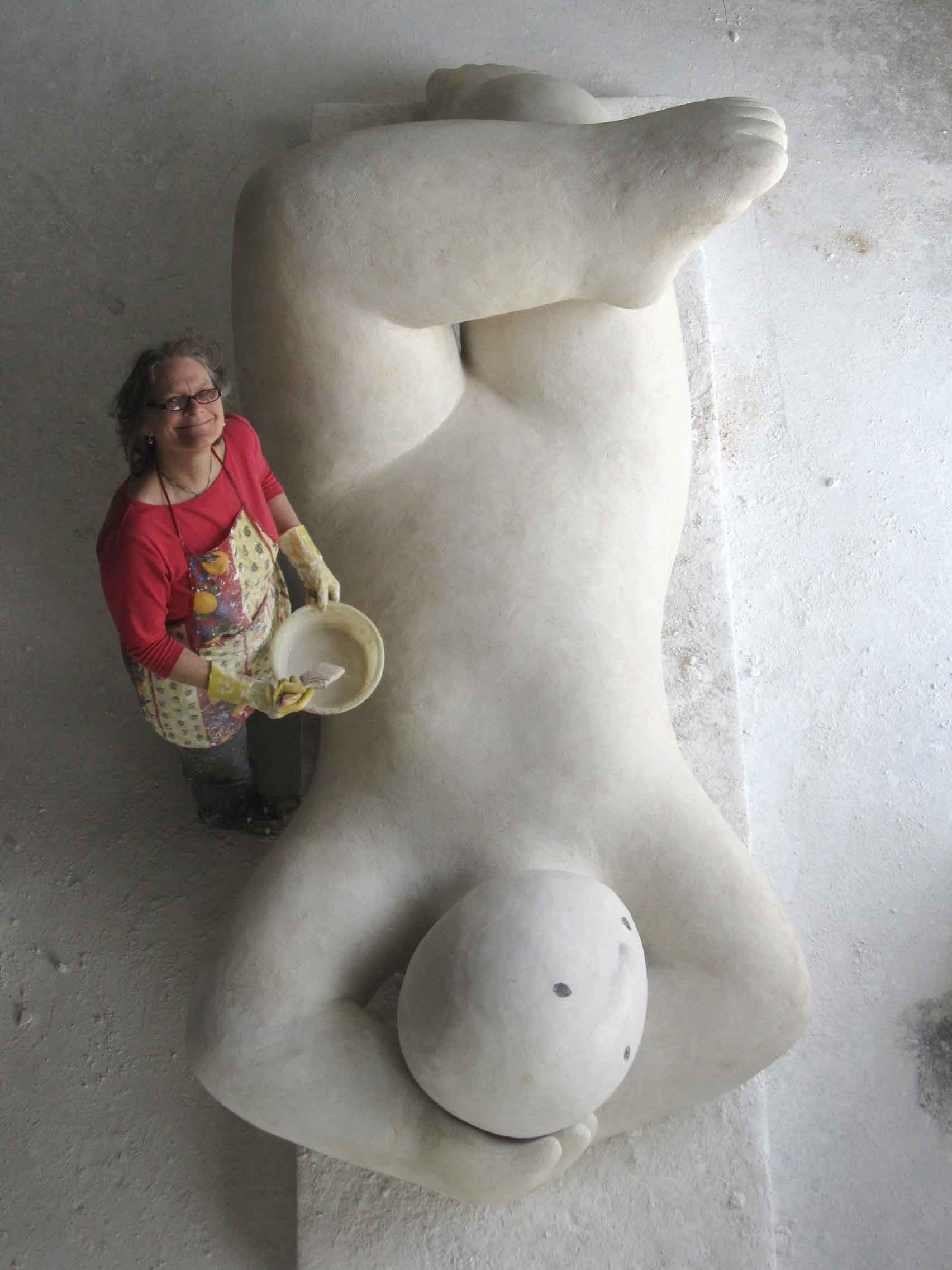 Joy Brown working on a plaster form to be cast in bronze, 2014.