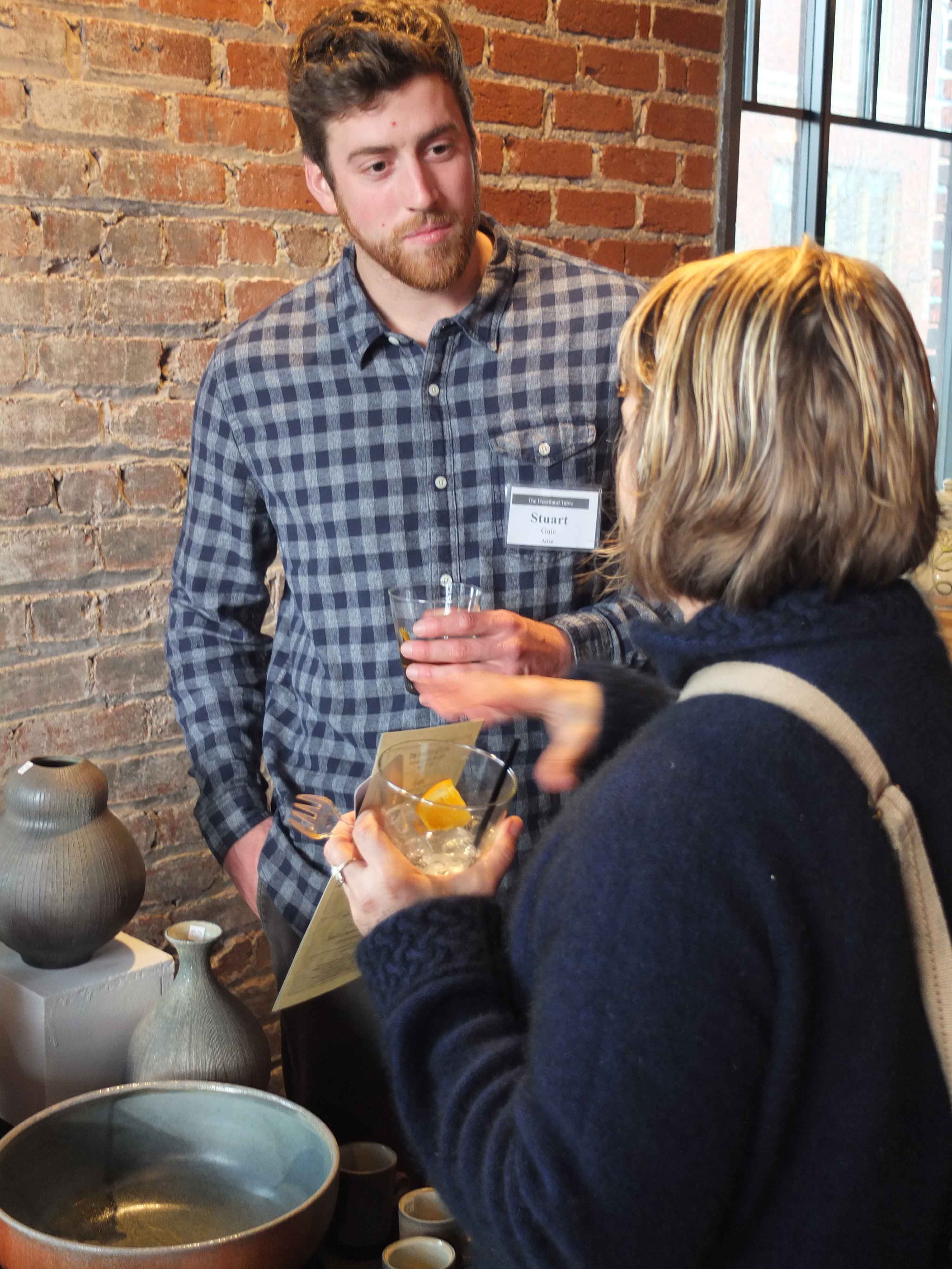 Stuart Gair talks with a guest, photo by Hollis Engley