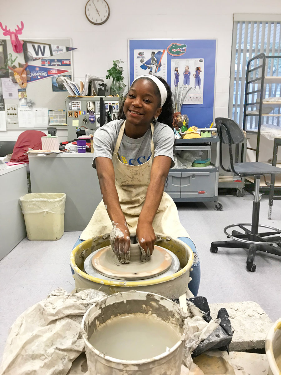 Keyontee Patterson learns wheel throwing in the Ceramics 1 class at Gainsville High School, 2018. All photographs by author.