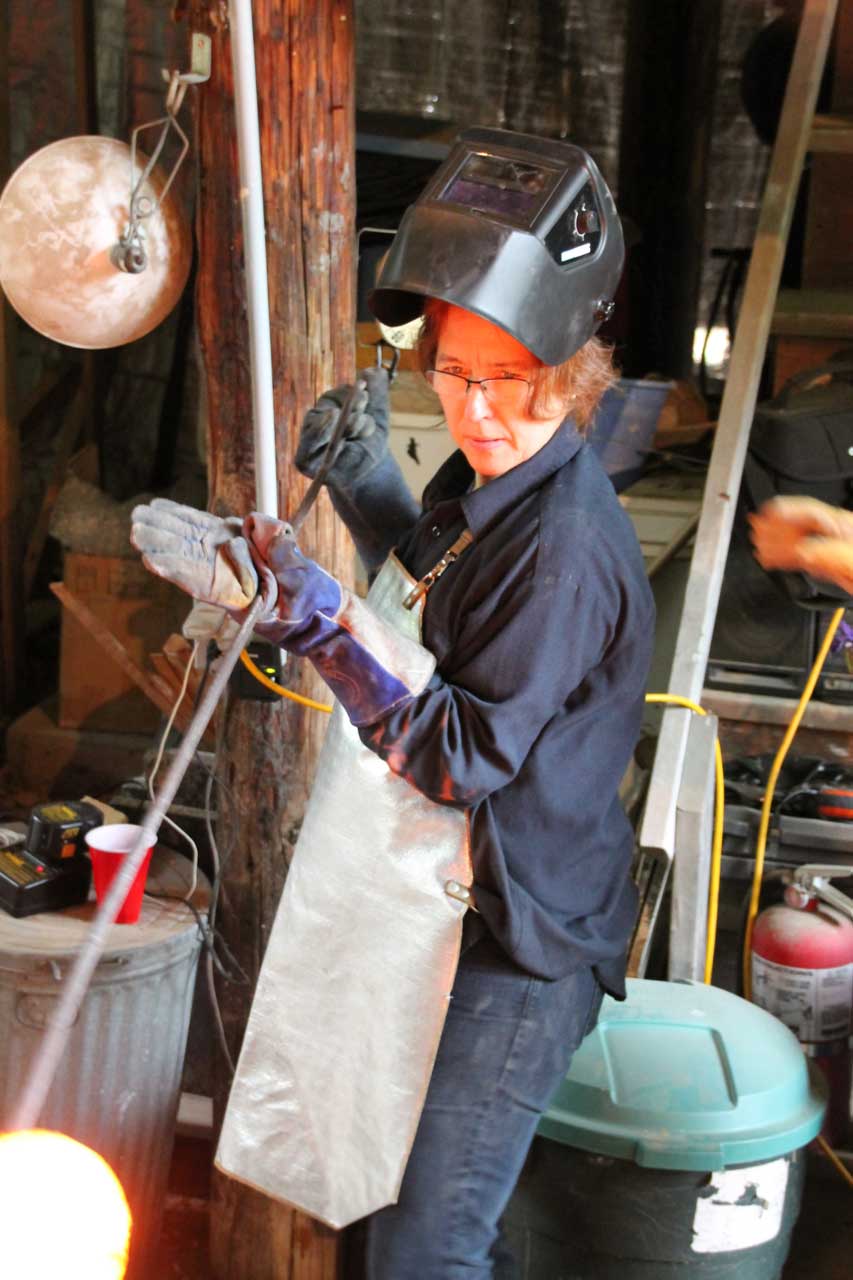 Muller pulls a piece of pottery from the kiln - hikidashi style.