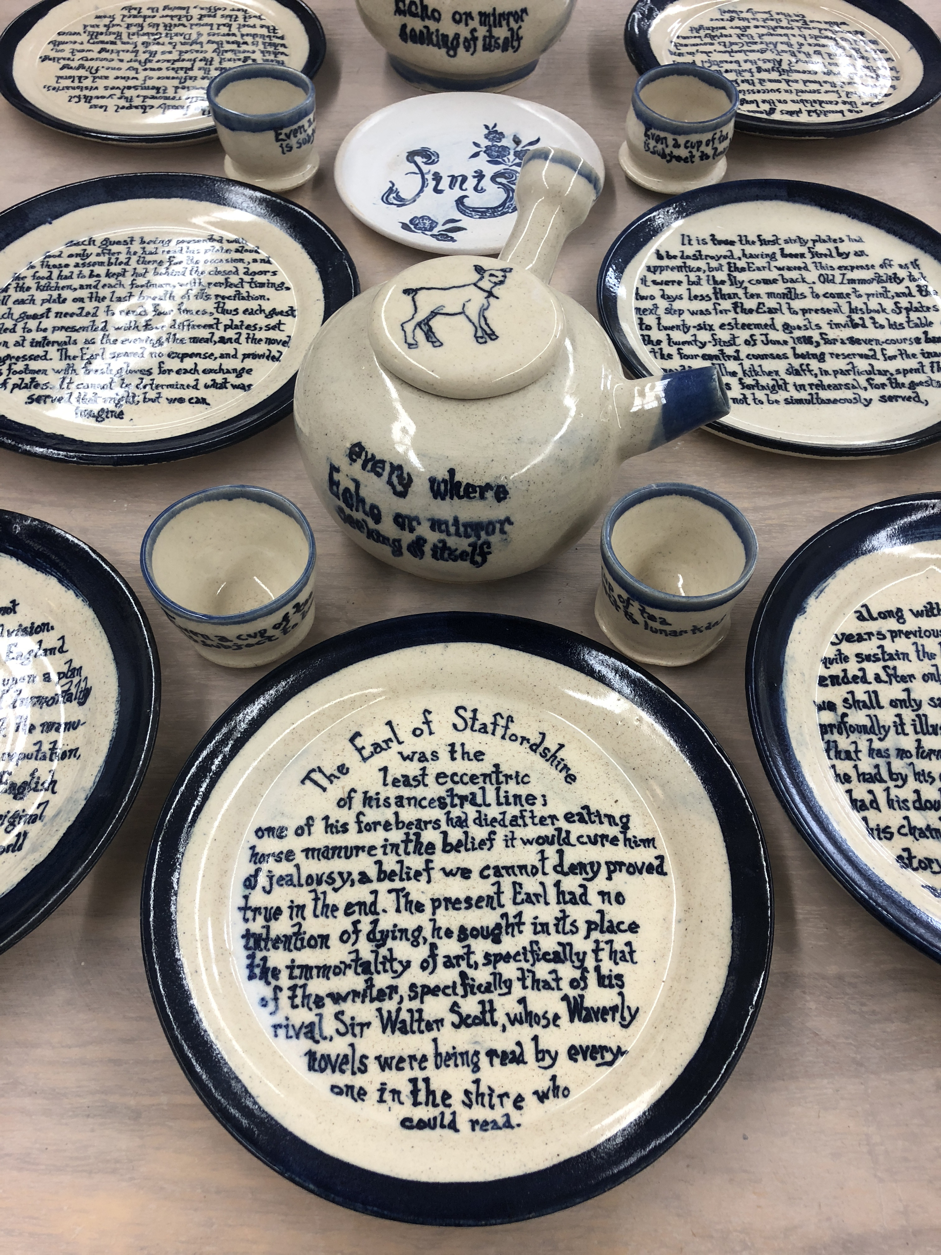 A dinner set for poet Mary Ruefle’s April 2020 reading at UMass Amherst has as a centerpiece a plate set inspired by her short prose piece “Old Immortality.” 