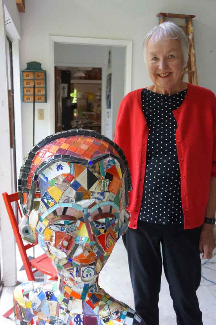 Sally Michener in her studio in Horseshoe Bay, British Columbia with one of her Janus Heads, June 2017. Photograph by Mary Ann Steggles.