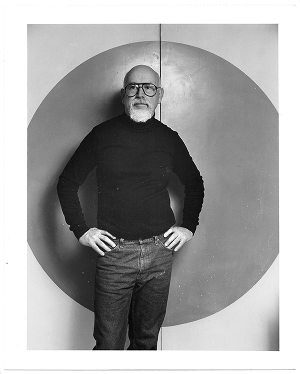 John Stephenson in front of his studio kiln room door, 1988. Photograph by Dirk Bakker.