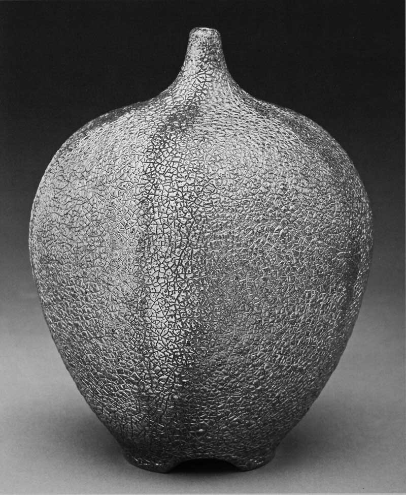 James C. Watkins. Bottle Form, 2013. Saggar-fired with Cone 04 glaze, fumed gold luster, 16 x 14 in. Photograph by Jon Thompson.