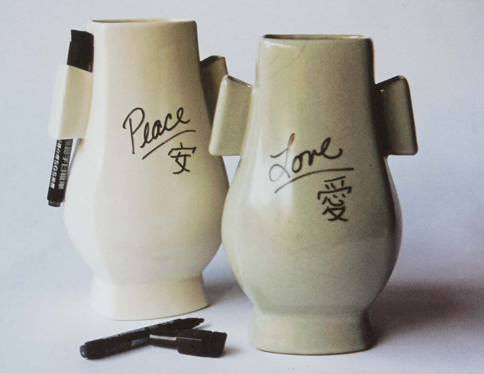 Ears Vase, 2012. Stoneware, slip-cast 9.5 x 6 x 5 in. Based on an historic Guanware Chinese vase. Originally, the &quot;ears&quot; of the vase were meant for a carrying rope, but I replaced the rope with dry-erase markers introducing and interactive element to the 