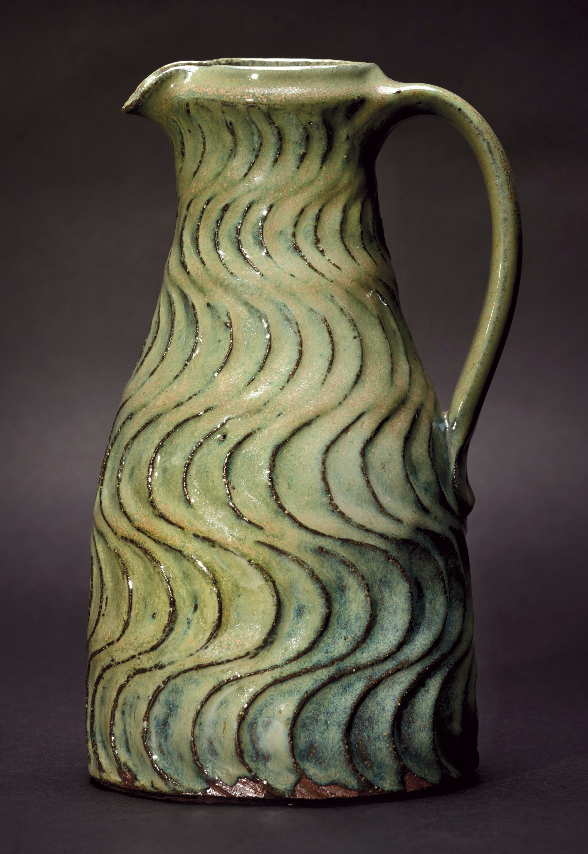Willi Singleton. Woodfired Carved Pitcher, 2016. Hawk Mountain and Chesapeake clays, cornstalk ash glaze with copper. 11 x 6 x 5 in. Photograph by KenEk Photography.