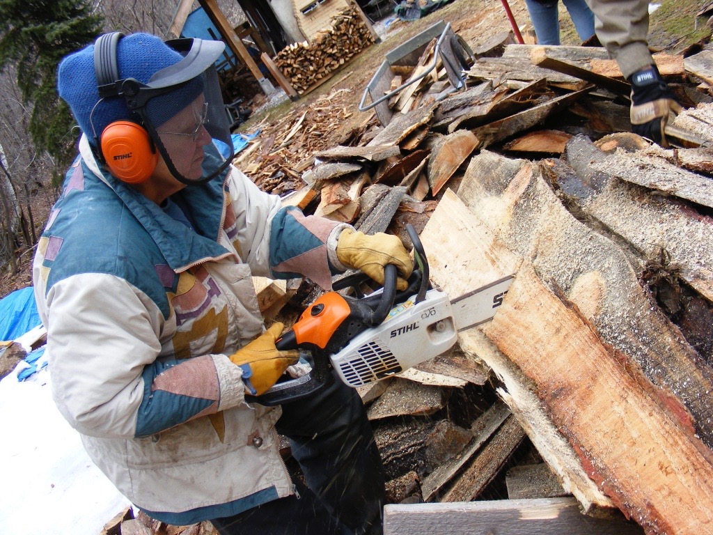 Magnusson effortlessly wielding her sharp-bladed chainsaw.