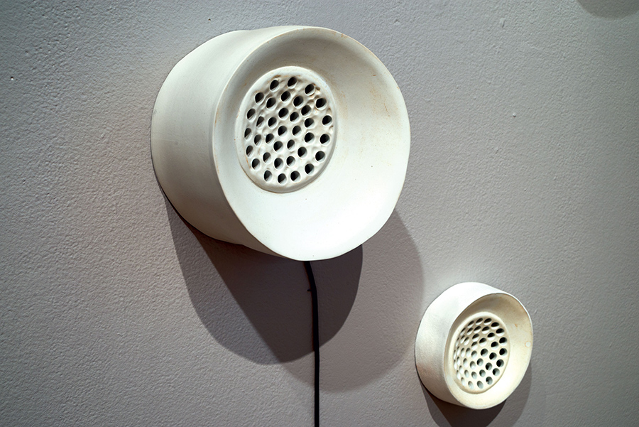 Nicole Gugliotti. Awe/Agency, detail, 2014. Porcelain, Stoneware, wood, paint, video projection, audio, monofilament. Full installation, 10 x 25 x 14 ft. Photo by Allen Cheuvront.