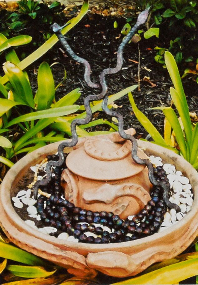 Osumare pot(s), Yoruba serpent deity, 2013. Unglazed earthenware, beads, shells, iron work, earth, bowl 15 in. Photograph by Awo Fáladé Òsúntólá.