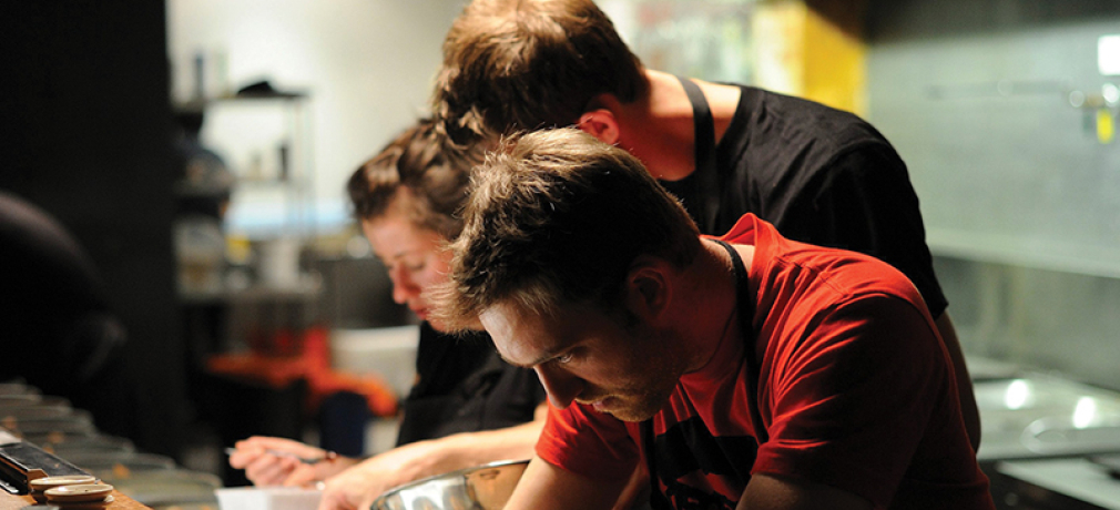 Pottery by Ben Richardson for Garagistes restaurant, Hobart, Tasmania. Culinary arts by Chef Luke Burgess (center, in red). Photograph by Chris Crerar.