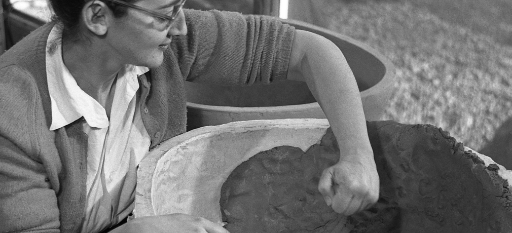Karen Karnes working on a molded planter, 1957. Photo by Ross Lowell.