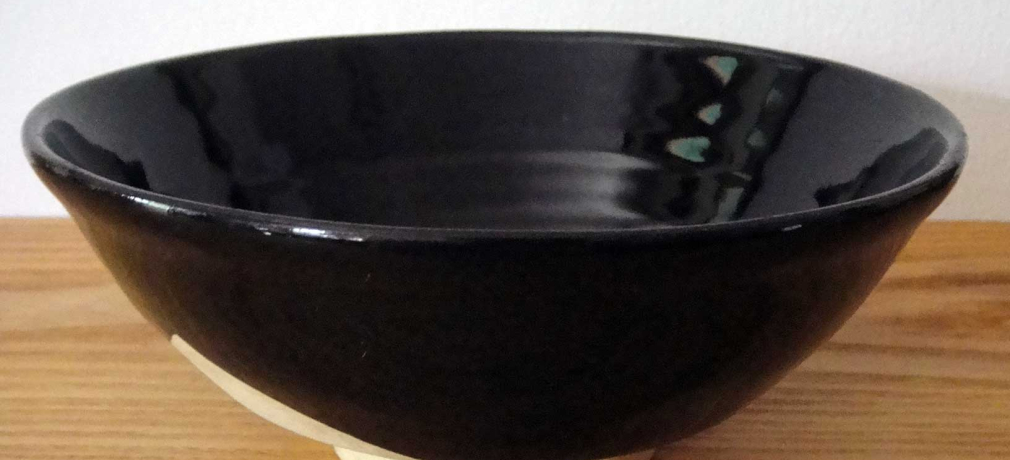 Black-glazed bowl, made in Tajimi, sold at Nagano station, 1967. Collection of Louise Cort. 