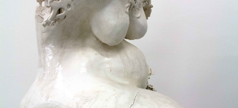 Olgu Sümengen Berker. Seated Figure, 2011. Slip-cast white clay, transparent glaze, fired to 1040 C., 13 x 16 x 20 in. Photo by artist. 