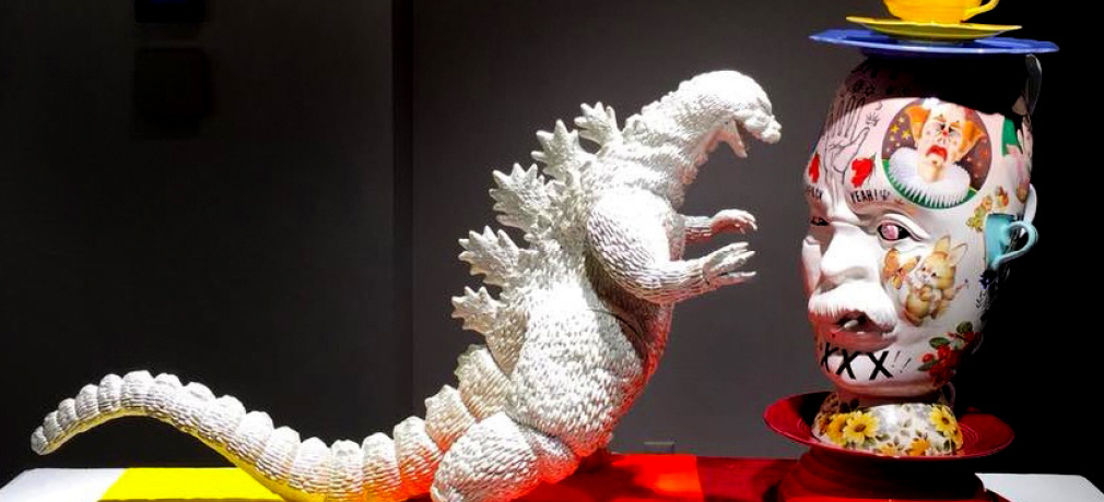 Mark Burns. Godzilla vs. King Kitsch, 2017. 28x40x14 in. Porcelain, glaze, plastic, metal, cement.