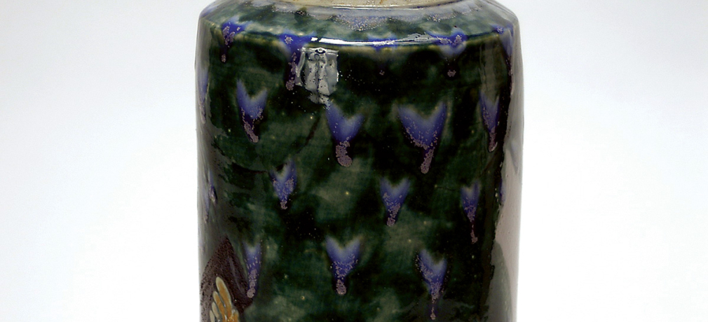 Norm Schulman. “Bag Lady” Jar, 1985. Engine painted, salt-glazed porcelain, 16.5 x 5.75 x 5.75 in.