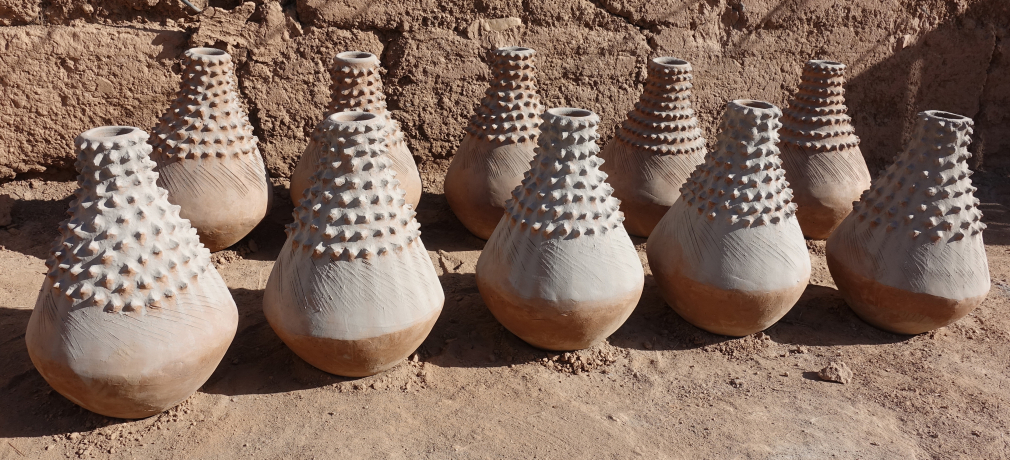 Astour, near Zagora, Oasis region. These unique pieces, nearly 30” high, were commissioned by someone in a big city as decorative pieces in a hotel or mall. The white coating is ash from the fire pit.