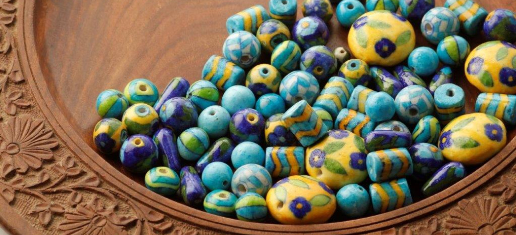 Neerja International. Jaipur blue pottery beads for making accessories.