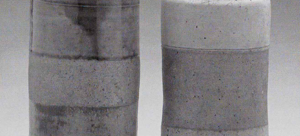 Heirloom Jars (Left) November 2003. Cone 11 woodfired stoneware, ash glaze over porcelain slip. H 12" x W 5". (Right) March 1972, bisqued, Cone 10 gas reduction stoneware, spodumene glaze. H 10.25" x W 5". Photograph by VanZandenbergen.