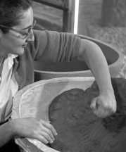 Karen Karnes working on a molded planter, 1957. Photo by Ross Lowell.