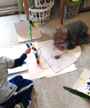 Robinson's kids decorating shopping bags with paints in her studio, 2016.
