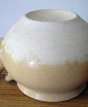 Concave base of the teapot, effective for use over direct heat. 