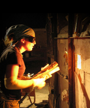 Heidi Kreitchet preparing to stoke the kiln at Pottery West, Las Vegas, Nevada. Photo by Kelly McLendon, 2010.