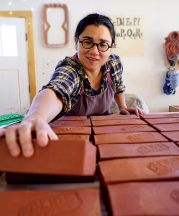 Ayumi Horie works on "Portland" bricks in her studio. Photograph by Janine Grant.