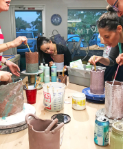 "Girls Night" at Studio T/M Pottery, Gainesville, Florida. Participants build flower vases of their own designs. See Truman's article, "Adventures in Rebuilding a High School Clay Program," page 18. Photograph by author. 