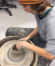 Preston Beckner throws on the wheel during the Advanced Ceramics class at Gainsville High School, 2017. 