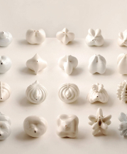 Jonathan Keep. Seed Bed, 2013. 3x3x4 in. each. Code-generated, 3D-printed porcelain clay and glaze. Photo by artist.