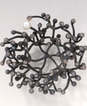 Watkins was close friends with many well known craftspeople, including metalsmith Merry Renk. Above: Brooch. Silver, pearl, smoky quartz; 2.5 x 3.5 in. Collection of Fuller Craft Museum. 