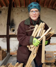 Maureen Mills gathers wood for the New Hampshire Institute of Art (NHIA) Fushigigama wood kiln in Sharon, New Hampshire, 2018. Photograph by Jennifer Markmanrud.