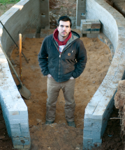 Noah Hughey-Commers starting work on the foundation of his kiln, February 2013. Photo by Stephanie Gross.