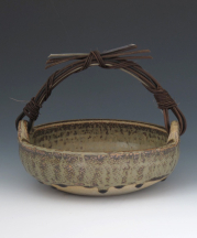 Basket with cane handle and ash glaze by Stewart. 
