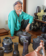 Wayne Ngan and his private collection of his own work, fired in his wood fired salt kiln on Hornby Island, British Columbia, June 2015. Photo by the author.
