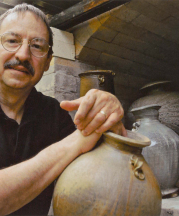 Dick Lehman Unloading Kiln, 2010. Photograph by Howard Zehr