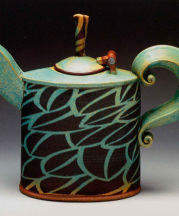 Teapot 10 inches tall. 2006. Stoneware, inlaid black slip, stretched slabs and extrusions, copper matt glaze, Cone 10 reduction.