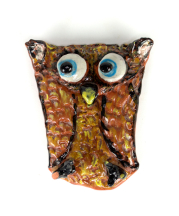 A teaching artist's sample of the folded-owl project, in which participants can build texture with limited manual dexterity. 
