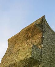 Ayelet Zohar, Villa in the Jungle, 2016. Camouflage nets over Benyamini Center. Photograph by Yael Gurand Zamir Nega.