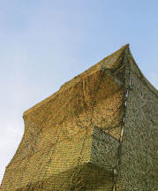 Ayelet Zohar, Villa in the Jungle, 2016. Camouflage nets over Benyamini Center. Photograph by Yael Gurand Zamir Nega.