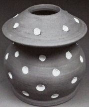 Pot for Yoruba/Lucumi Sakpata or Babalu Aye, deity of smallpox and pestilence, 2012. White indentations recall smallpox scars; hole in lid allows the insertion of the ritual "broom" with which Sakpata sweeps his power across the earth. 