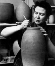 Vivika signing pots, 1952. Photo from Studio Potter, Vol. 22, No. 2, 1994, “Vivika and Otto Heino, Living Pots,” interview by Gerry Williams.