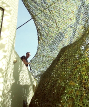 Ayelet Zohar, 'Villa in the Jungle,' 2016. Camouflage nets over Benyamini Center, supported by the Arts Department, Tel Aviv-Jaffa Municipality and the Yehoshua Rabinovich Tel Aviv Foundation for the Arts. Photograph by Yael Gur and Zamir Nega.
