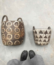 Melissa Weiss. Basket (left, with circles), 2018. 20x12 in. Coil-built. Bucket (right, with triangles), 2017. 12 x 10 in. Slab- and mold-built. Both wild clay custom stoneware body, slip, ash glaze, iron wash; Cone 10 reduction, reduction cooled. 