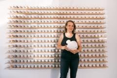 Aubrey Sloan in front of the installation “A Year and A Day.”Image courtesy of Ty and Chey.