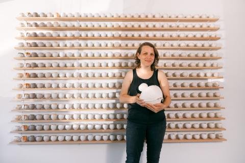 Aubrey Sloan in front of the installation “A Year and A Day.”Image courtesy of Ty and Chey.