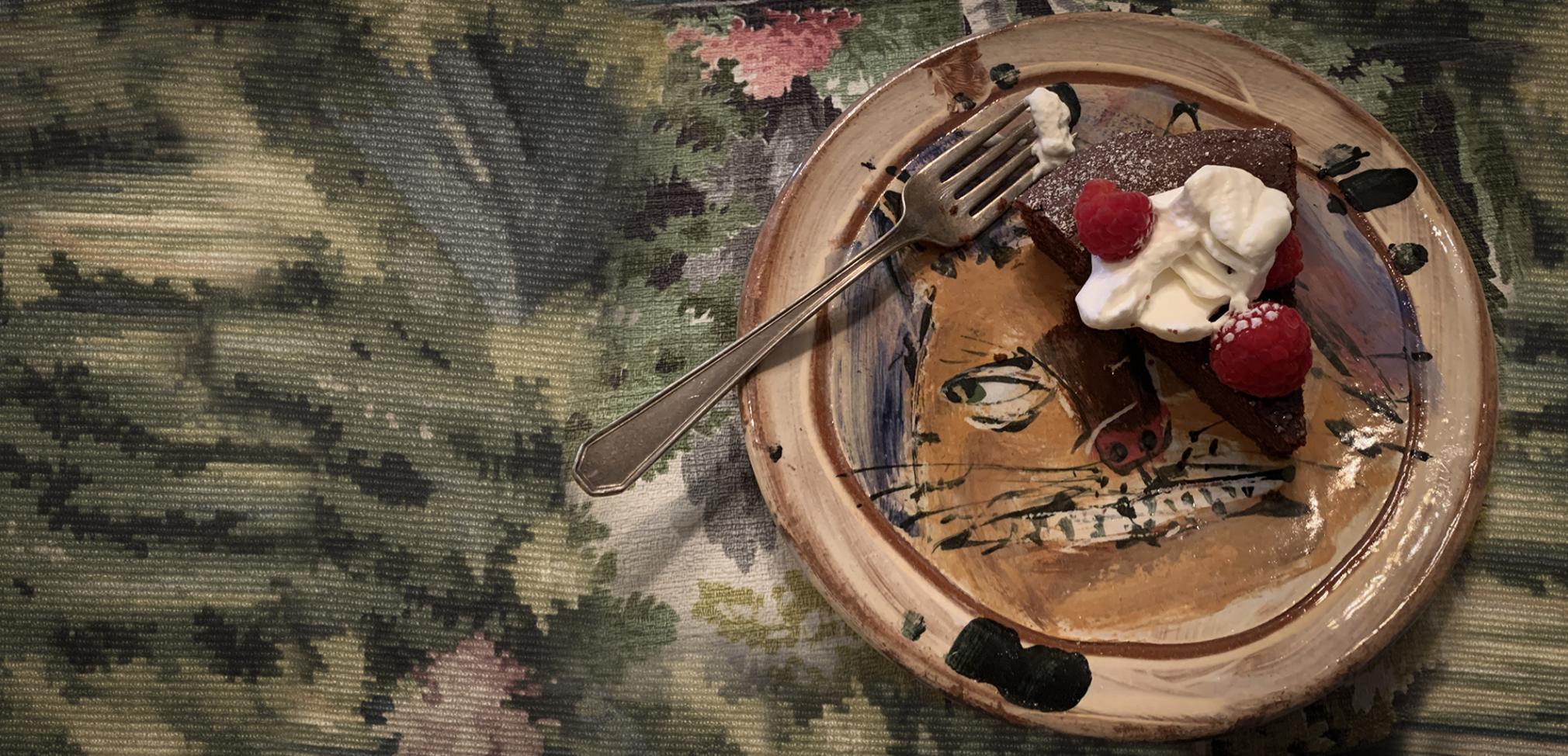 Surprise! Ron Meyers Dessert Plate.  At many a house in Athens, when invited for a meal, you could be presented with fantastic pottery that peeks through whatever delicious thing that is being served.